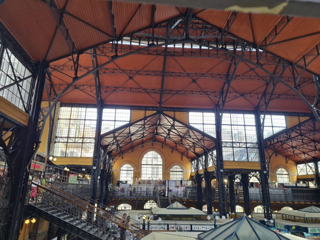 Ornate 19th-century wrought-iron roof inside Budapest's Central Market Hall