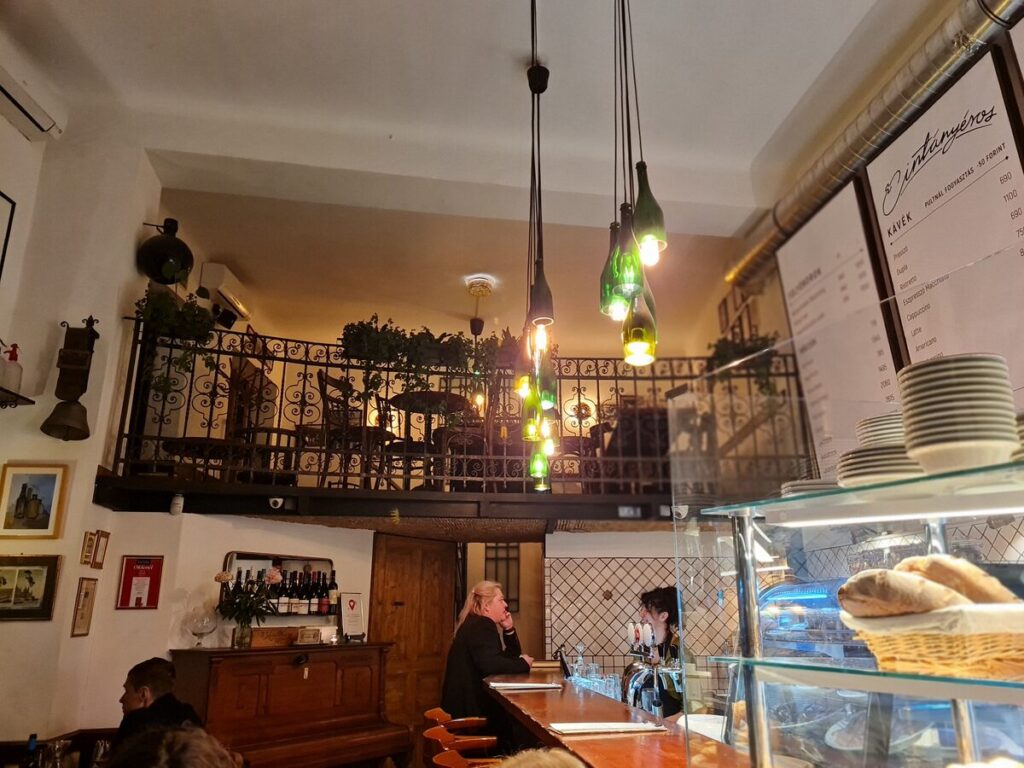Interior balcony seating at Cintányéros restaurant, Budapest