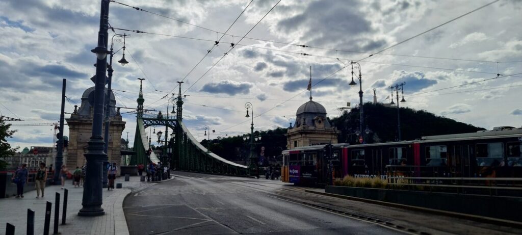Liberty Bridge over the Danube with a yellow tram crossing, Budapest