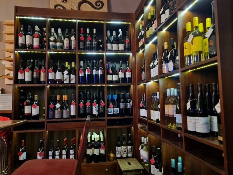 Floor-to-ceiling wine bottle shelves inside Vinowonka wine bar, Budapest