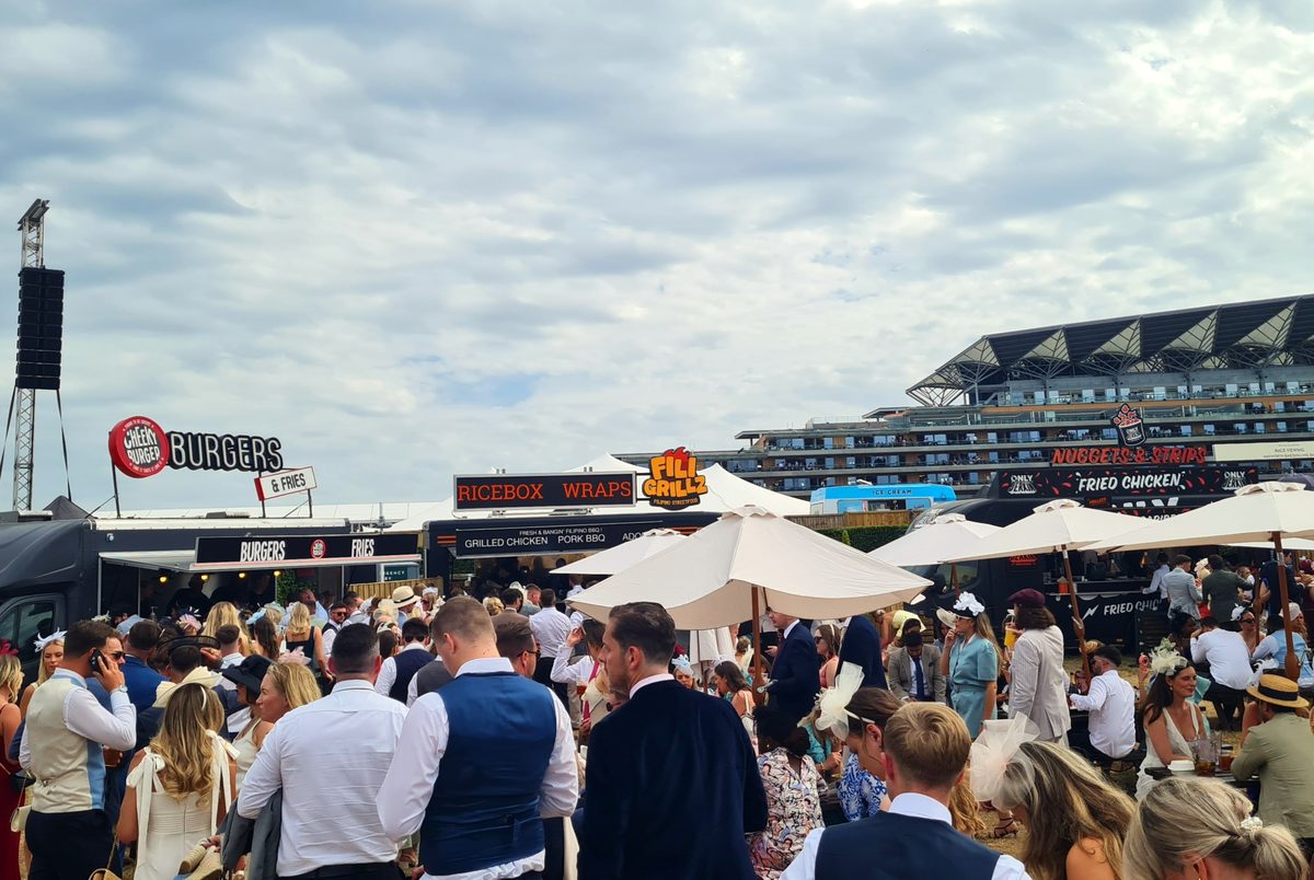 Food stall area at Royal Ascot Village Enclosure featuring Cheeky Burger, FiliGrillz and Ricebox Wraps street food vans