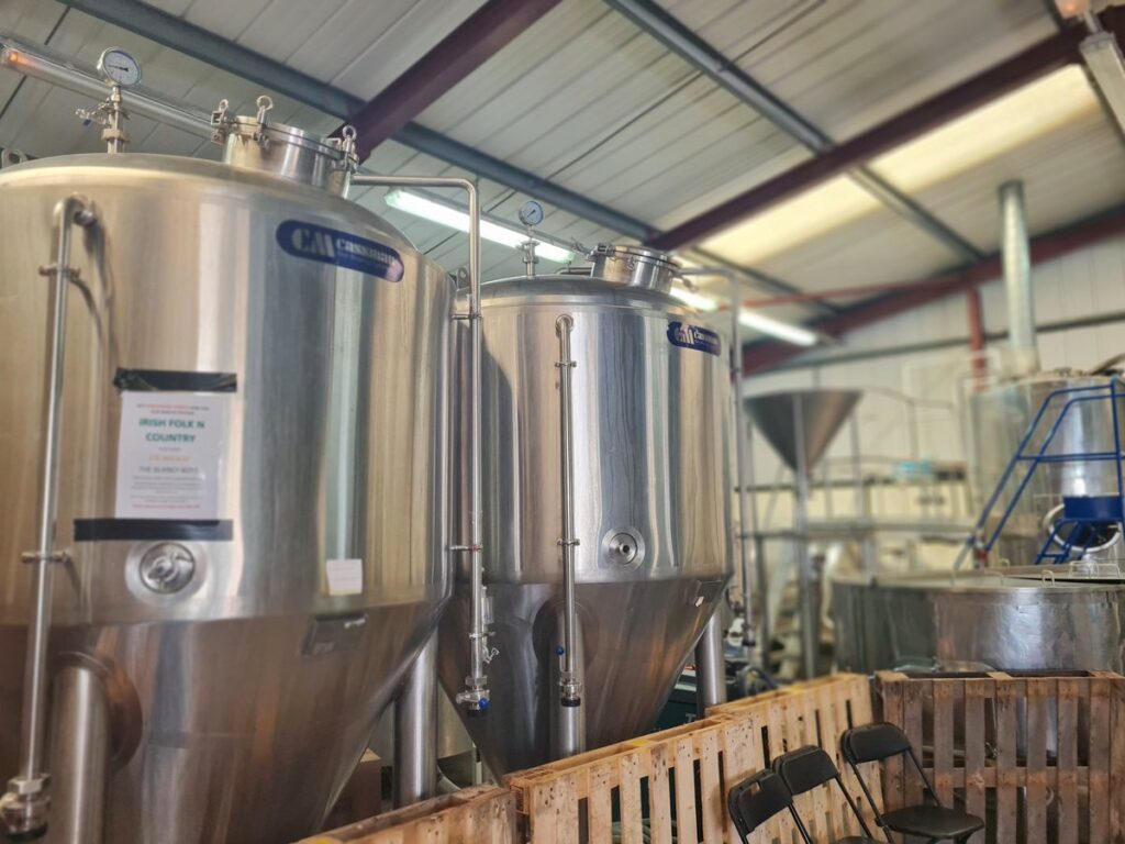 Stainless steel fermenting vessels inside Durham Brewery at Bowburn