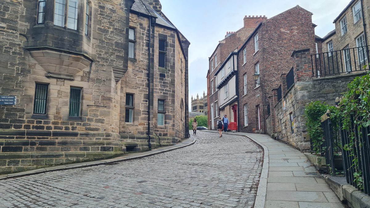 The cobbled lane of Owengate in Durham leading up towards Palace Green