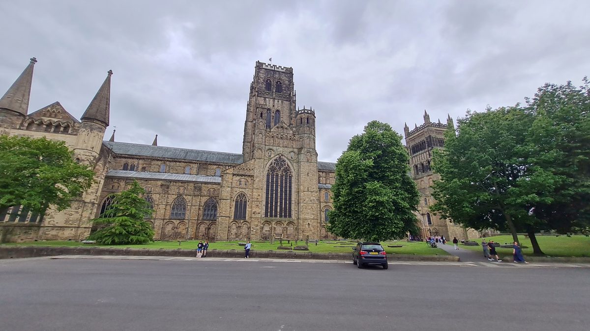 Durham Cathedral seen across the open lawn of Palace Green