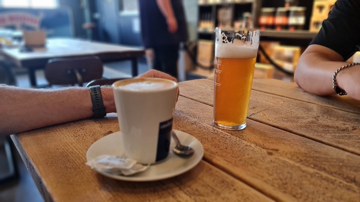 Coffee and craft beer on a wooden table at Windsor and Eton Brewery taproom