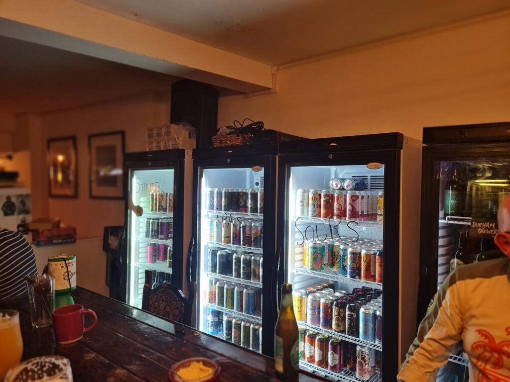 Fridges of craft beer cans and bottles at The Holy GrAle, Durham