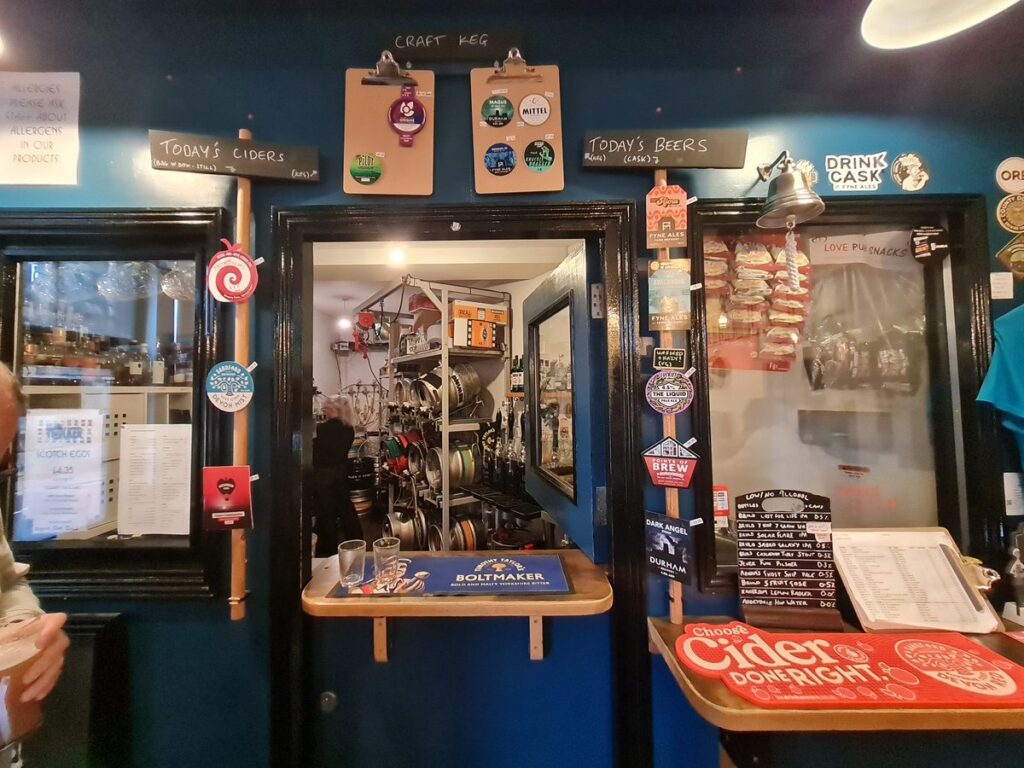 The serving hatch and beer boards at The Station House, Durham