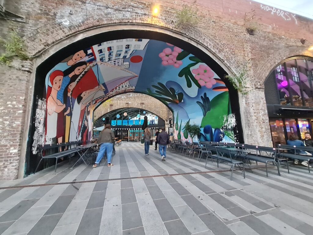 Painted railway arch tunnel leading to 3 Locks Brewing Co, Camden, London