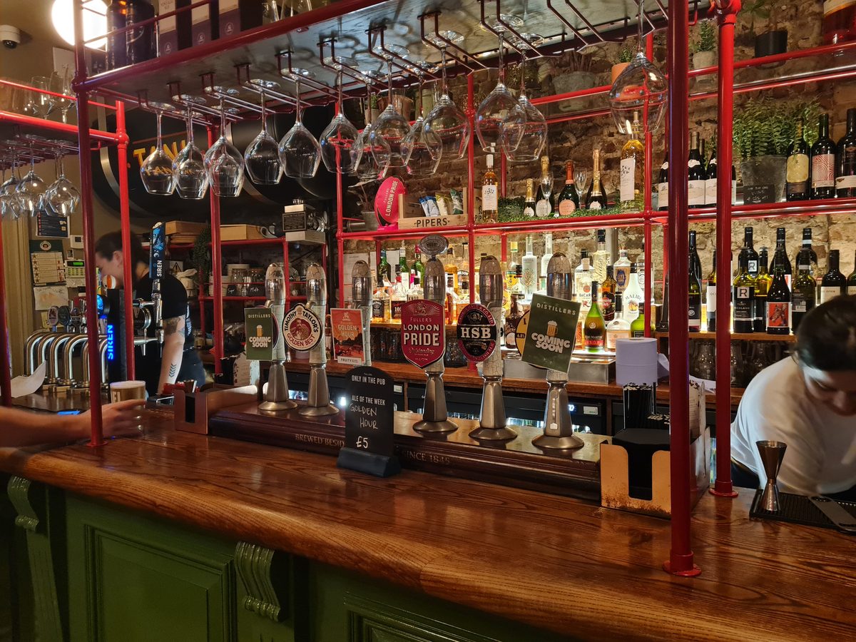 The industrial red-framed bar at The Distillers, Hammersmith, London