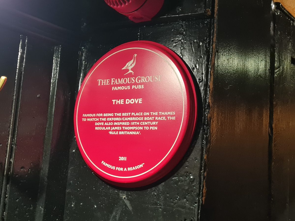 Red Famous Grouse plaque at The Dove, Hammersmith, about the Boat Race and Rule Britannia