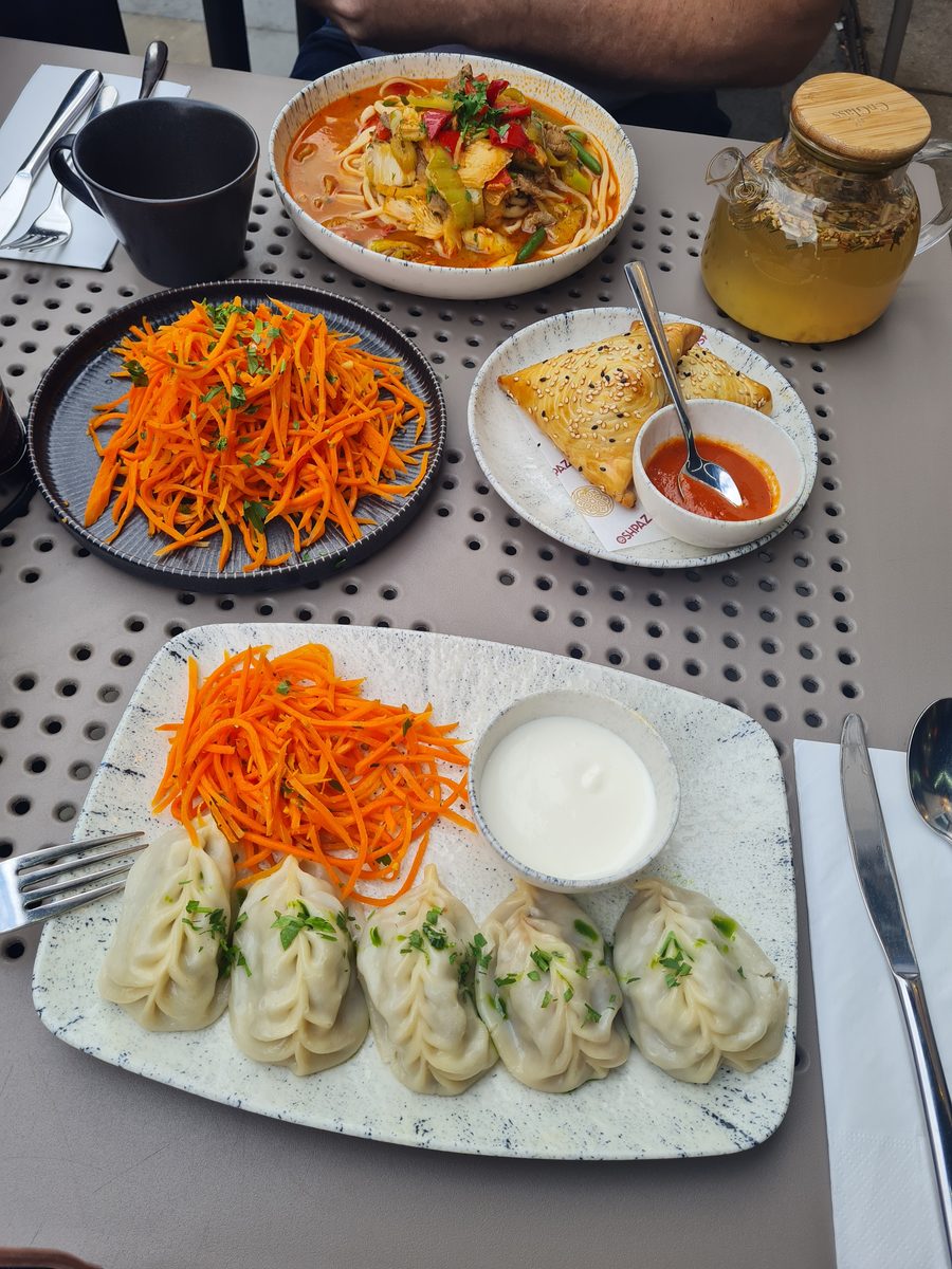 Uzbek manti, lagman soup and carrot salad at Oshpaz restaurant, London