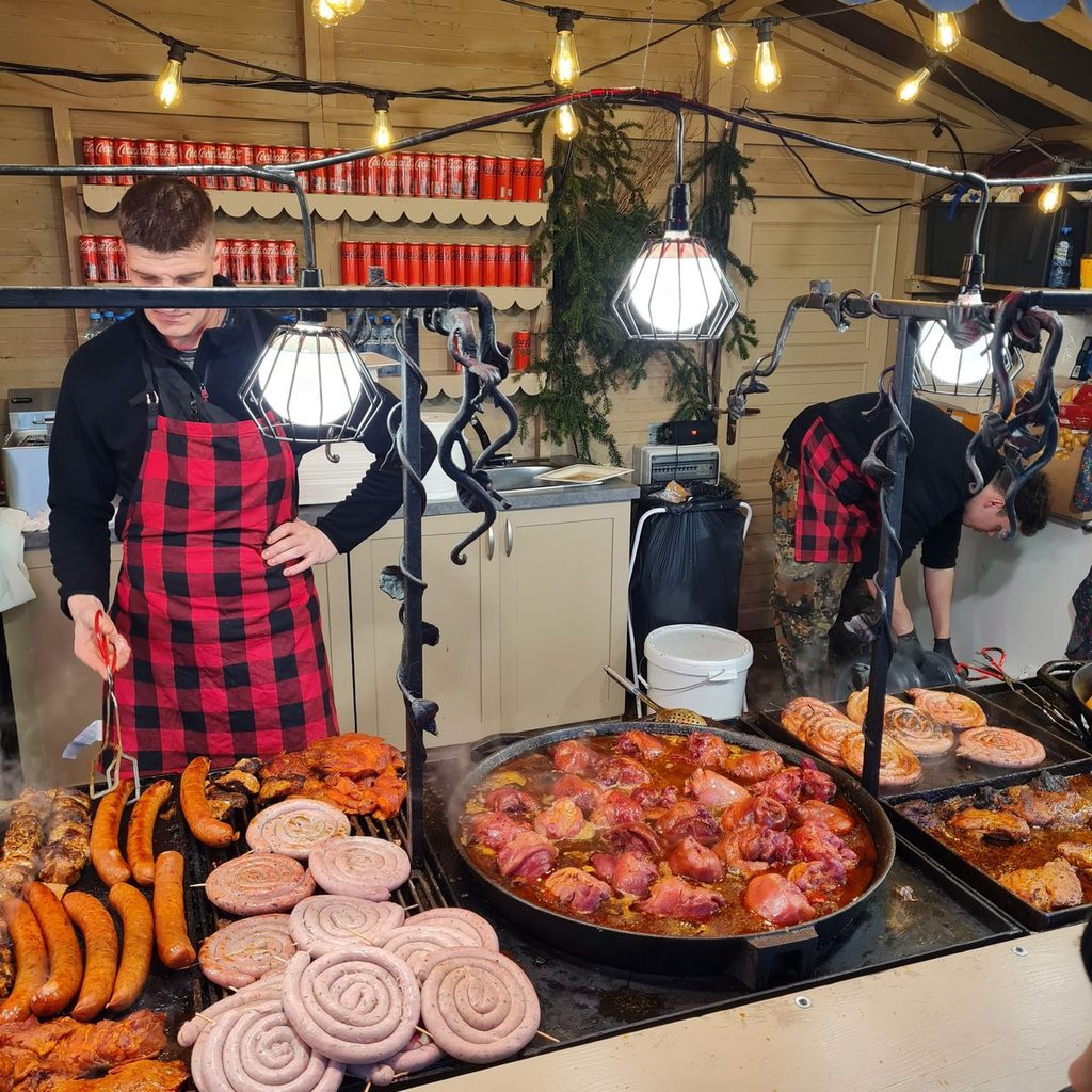 Sausages on an open grill at the Kraków Christmas market