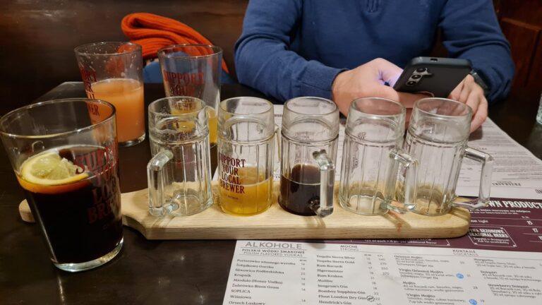 Beer flight on a wooden paddle at CK Browar, Kraków