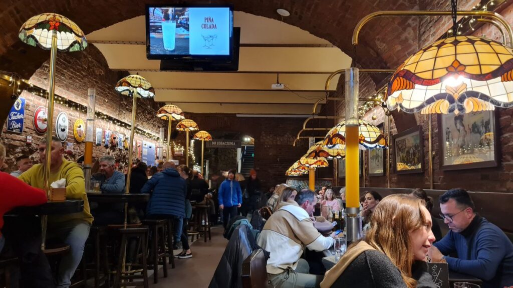 The busy vaulted beer hall at CK Browar on Podwale, Kraków