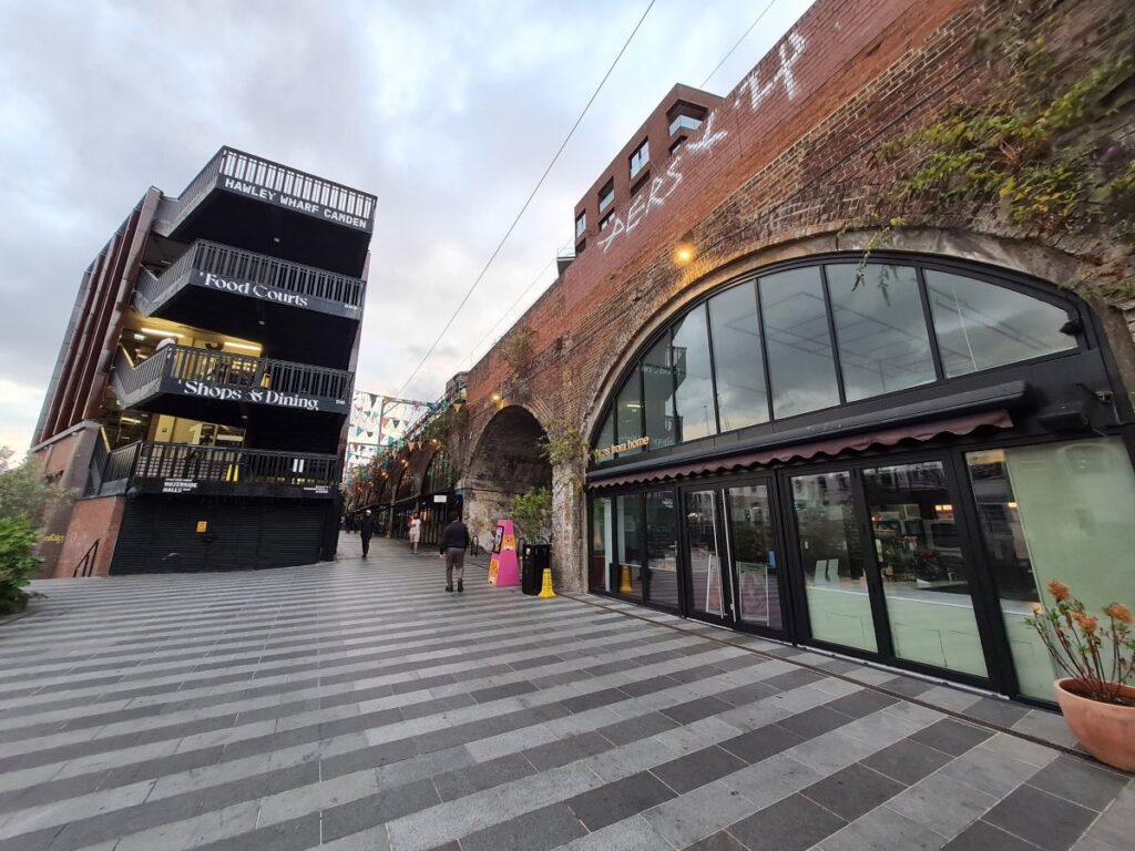 The Hawley Wharf Camden building signed Food Courts and Shops and Dining, beside the railway arches, London