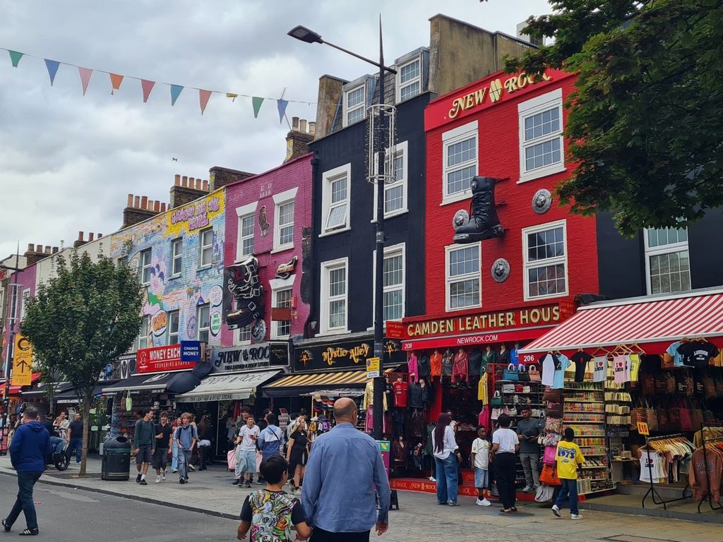 Painted shopfronts and crowds on Camden High Street, London