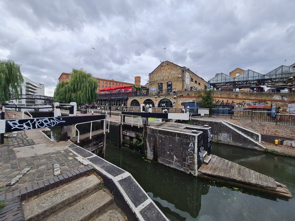 The lock gates at Camden Lock on the Regent’s Canal, with the market buildings behind, London