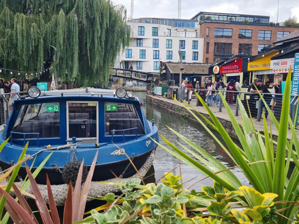 A narrowboat moored on the Regent’s Canal at Camden Lock, London