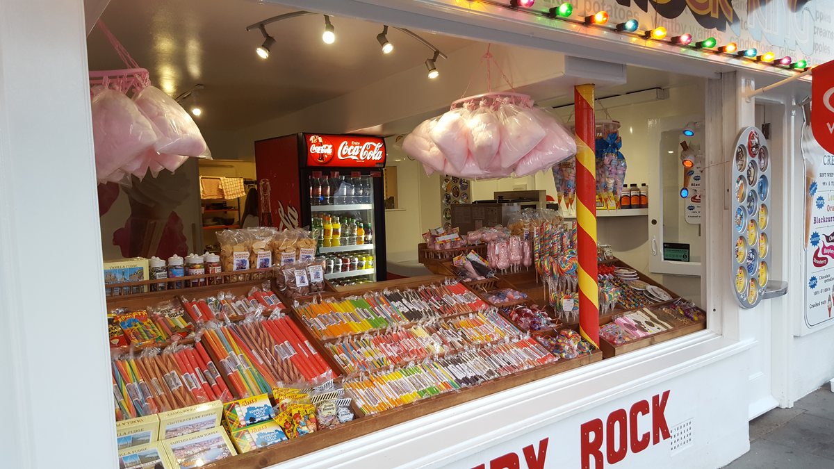 Inside a Whitby rock and sweet shop, counters full of sticks of rock