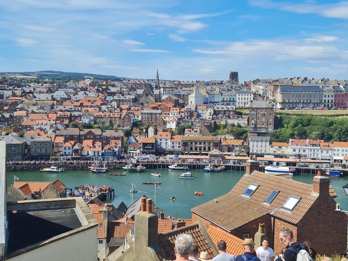 Whitby's red rooftops and the harbour seen from the 199 steps